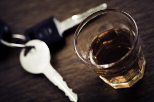 Keys and drink on table.